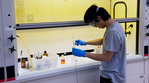 SAC student in a chemistry lab
