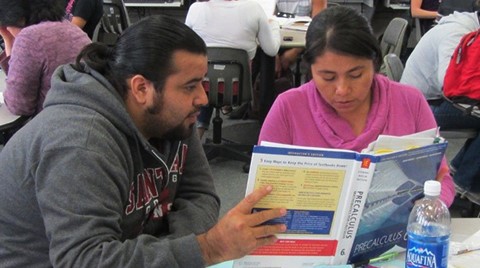 Santa Ana College tutor assisting SAC student in math