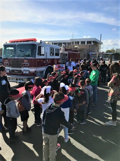 Kindergarteners lining up to see a firetruck