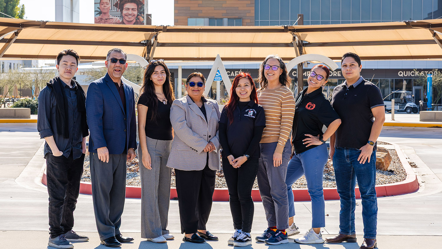 Career Center staff standing in front of Campus Entrance