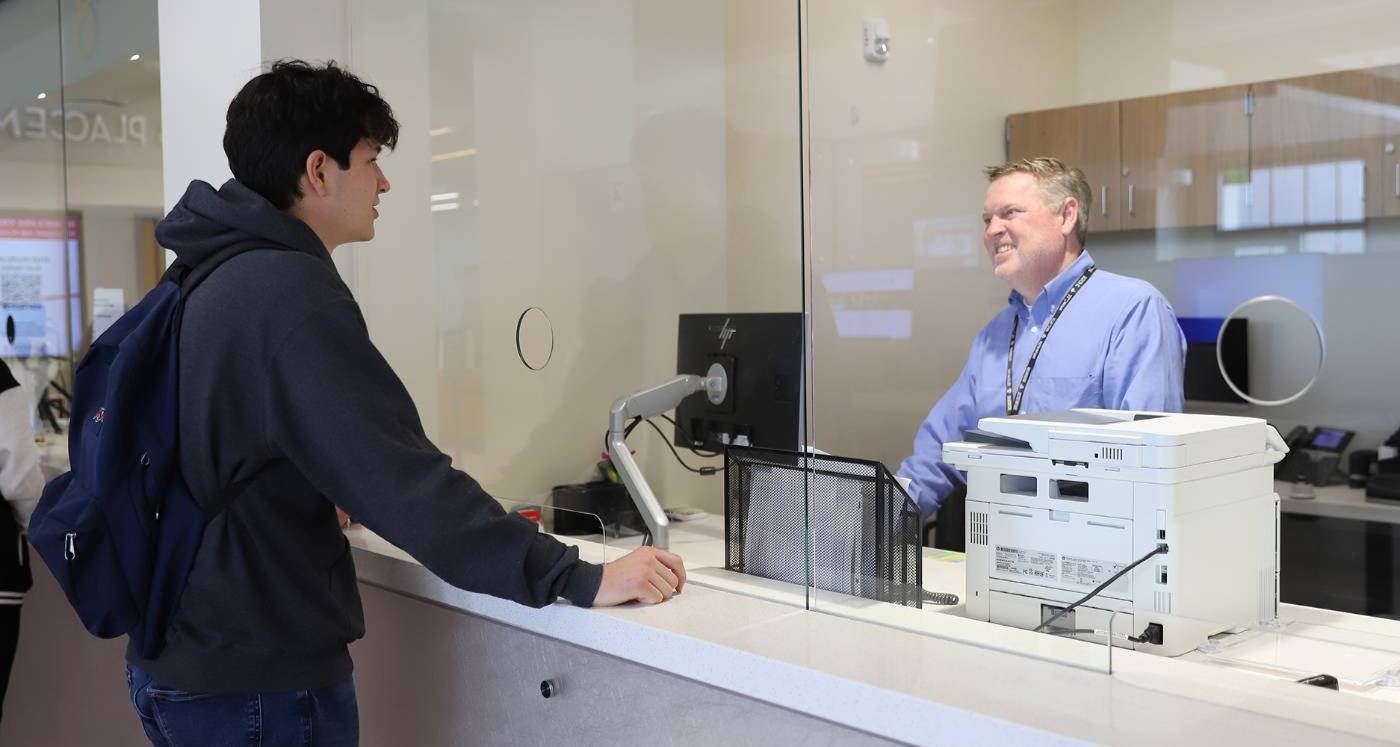 male student at financial aid window