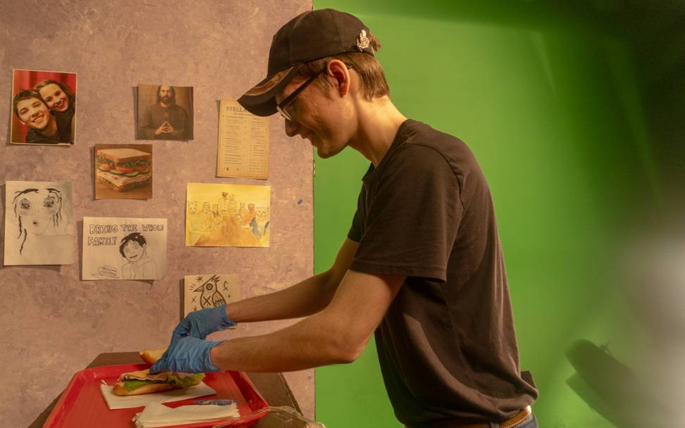 student-working-with-food-prop