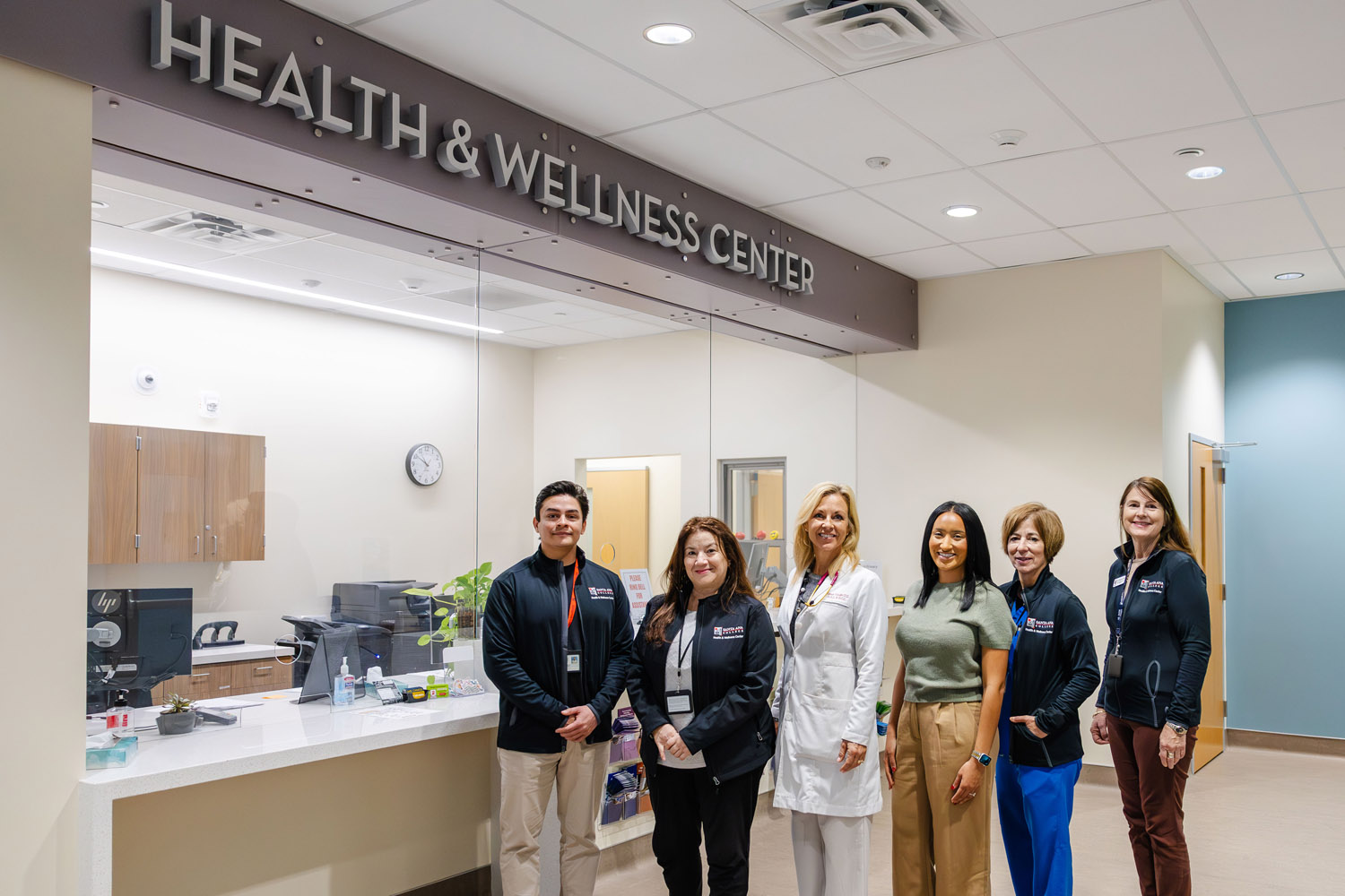Health and wellness staff standing in lobby