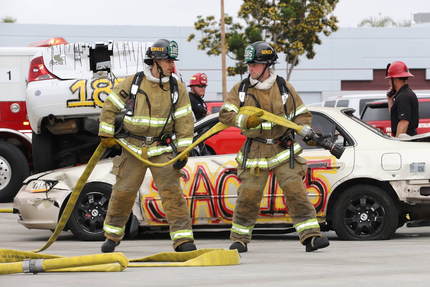 firefighters with fire hose