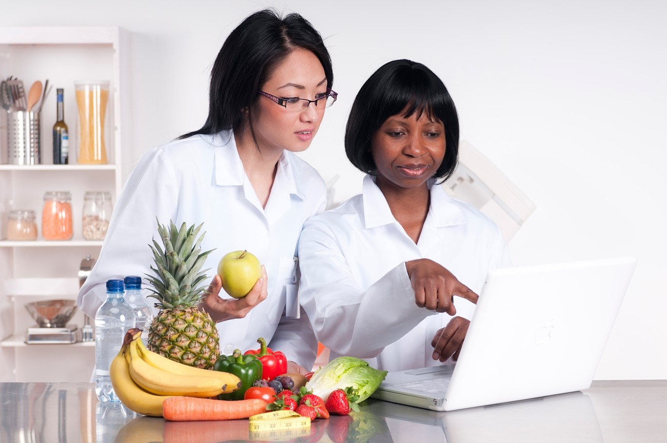 two scientists researching fruits