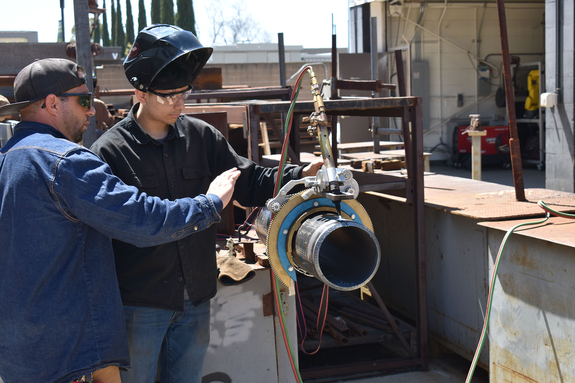 Welding Instructor helping student