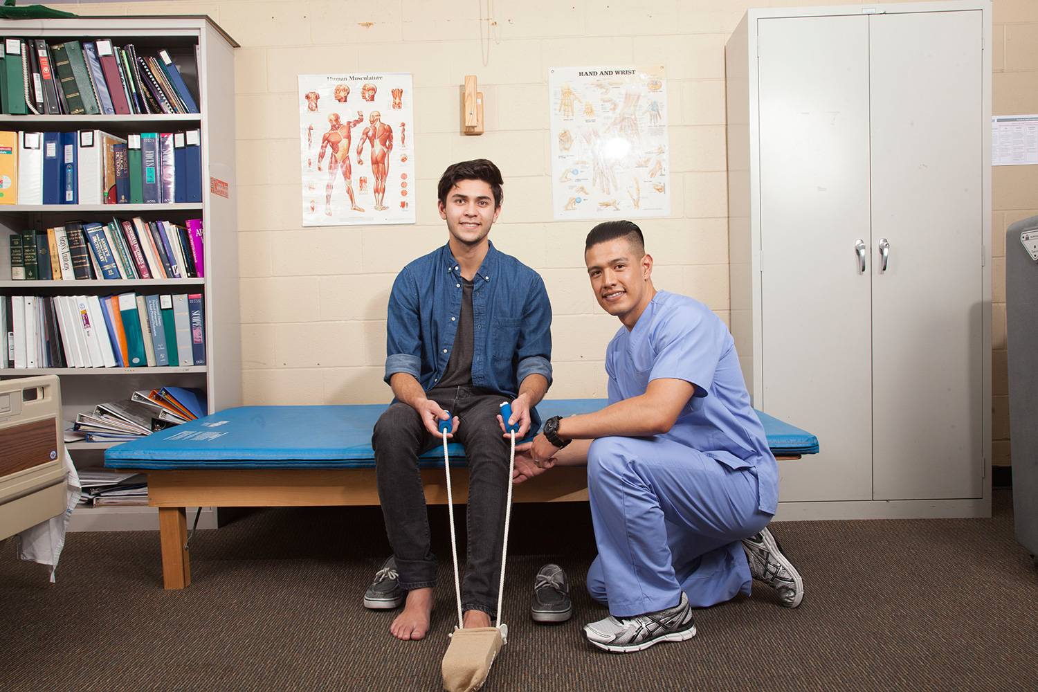 OS Student practicing leg support on classmate