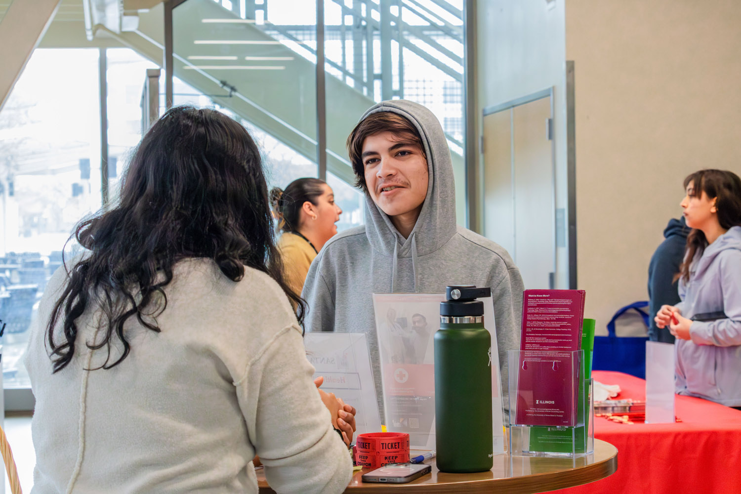 student at welcome week table