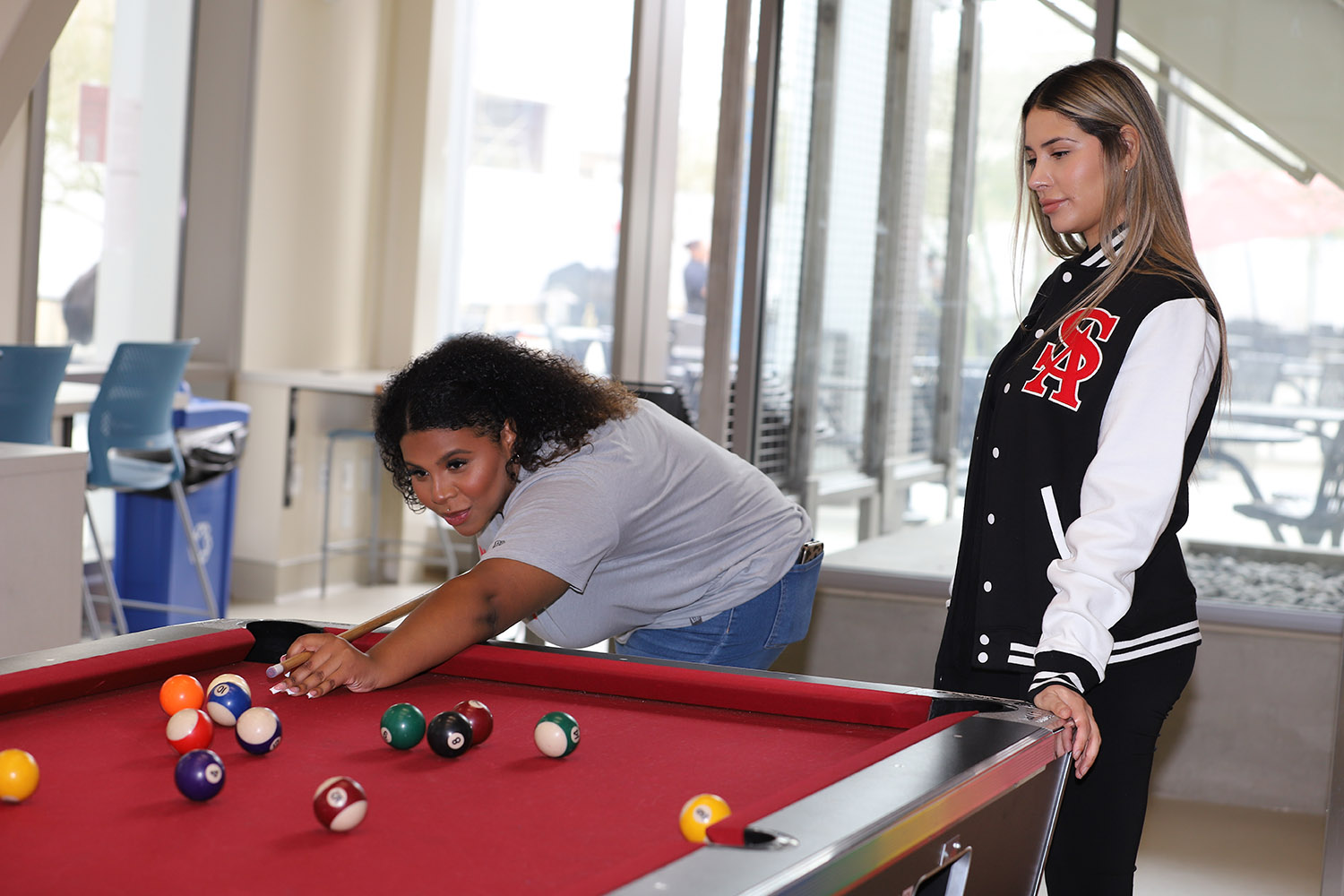Students playing pool at the Spot