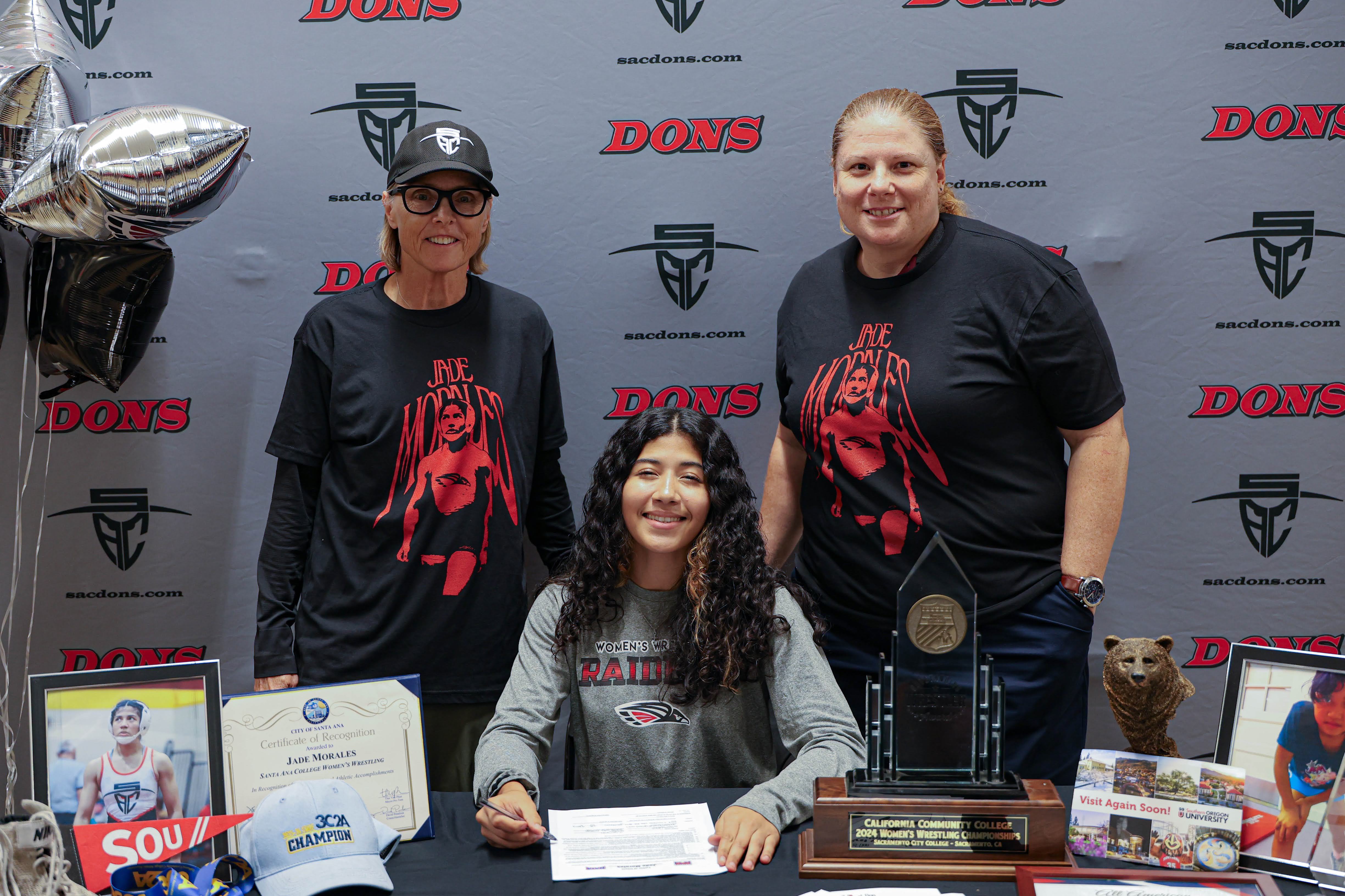Jade Morales signing her Letter of Intent to Southern Oregon University 