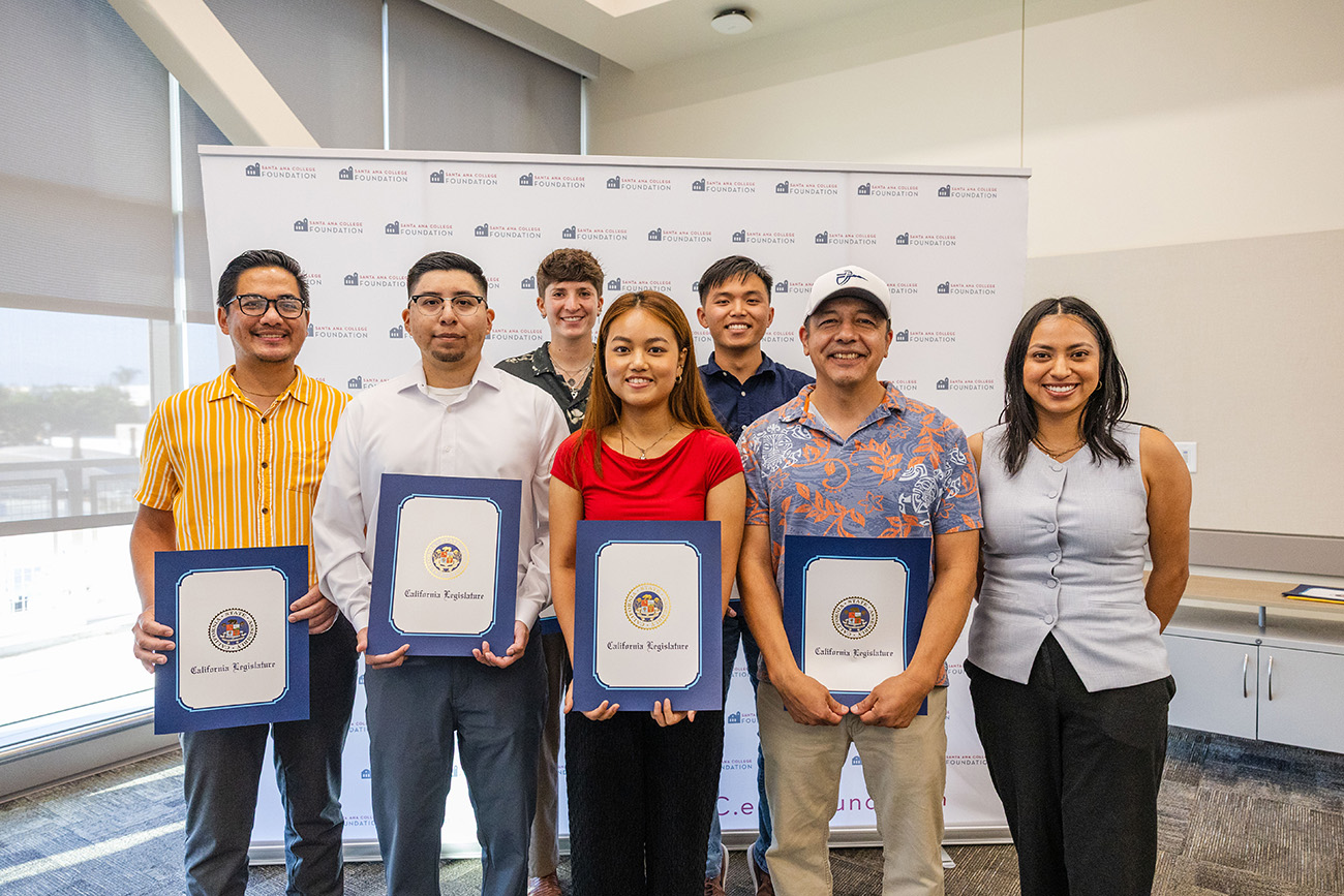 Team Mekah students and faculty advisor pose with certificate of recognition from Avelina Valencia