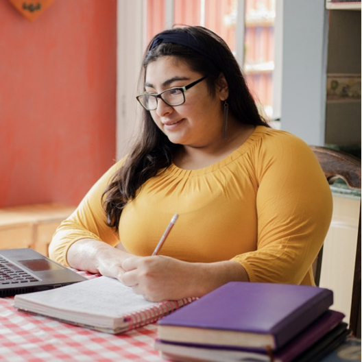 Woman taking care of children after starting her own childcare business using skills learned at Continuing Education