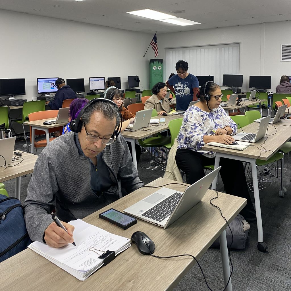 Diverse employees providing tech support after learning Information Technology Basics at Santa Ana College