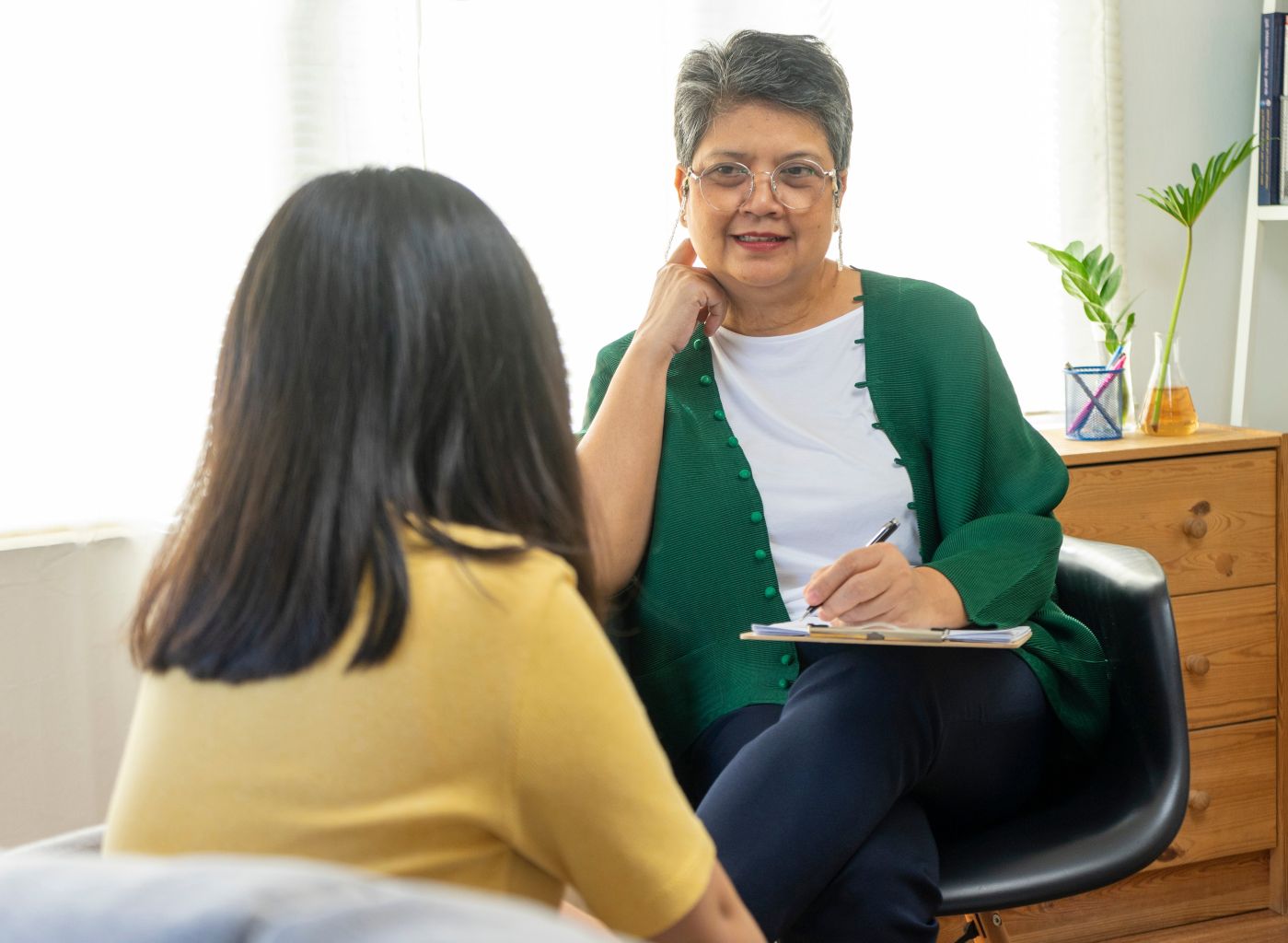 Older woman working as mental health counselor, helping people with training from Santa Ana College School of Continuing Education.