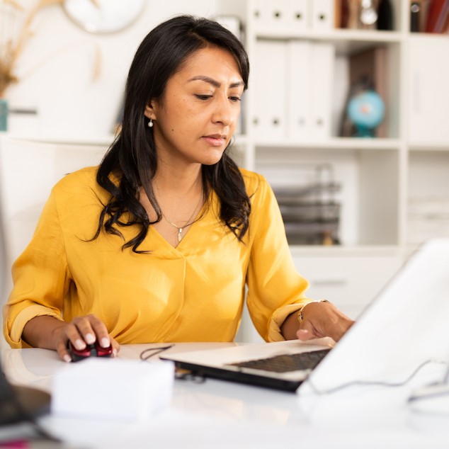 Smiling woman working as general office clerk using the free training from continuing education