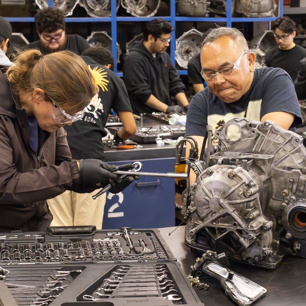 Automotive Technology and Engine Repair Diverse older students fixing an engine at Remington Education Center in Orange County, California