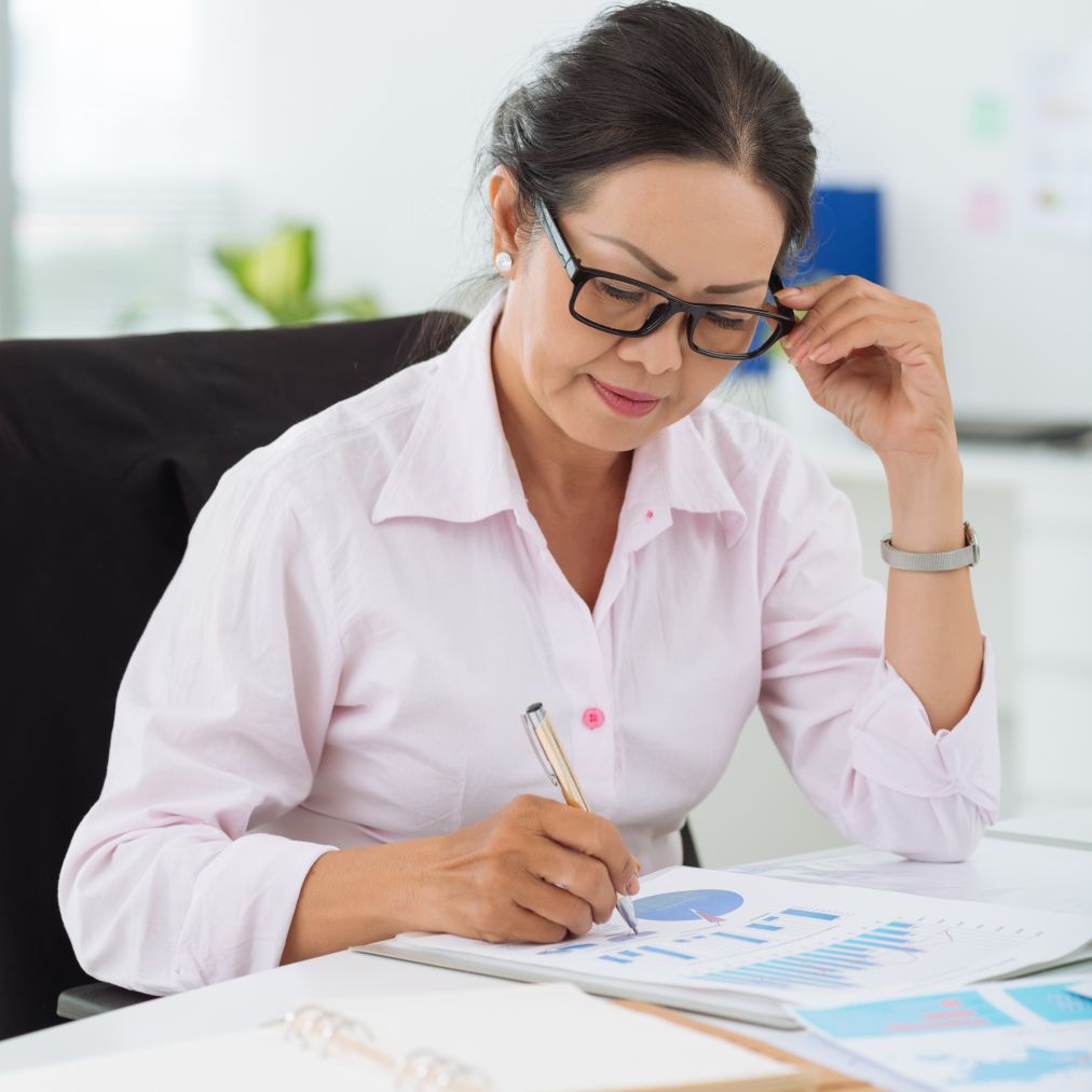Vietnamese woman accountant working successful finance job with skills learned at Santa Ana College