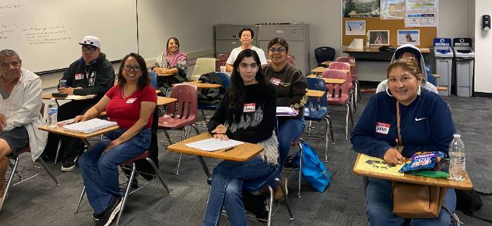 Students in a classroom getting ready to learn