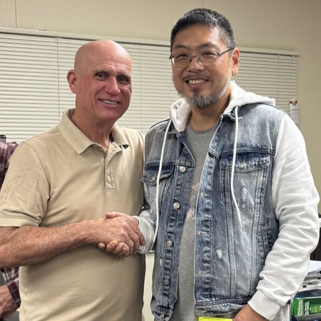Smiling Asian man completing career education certificates and finding new jobs through free classes at Santa Ana College Continuing Education