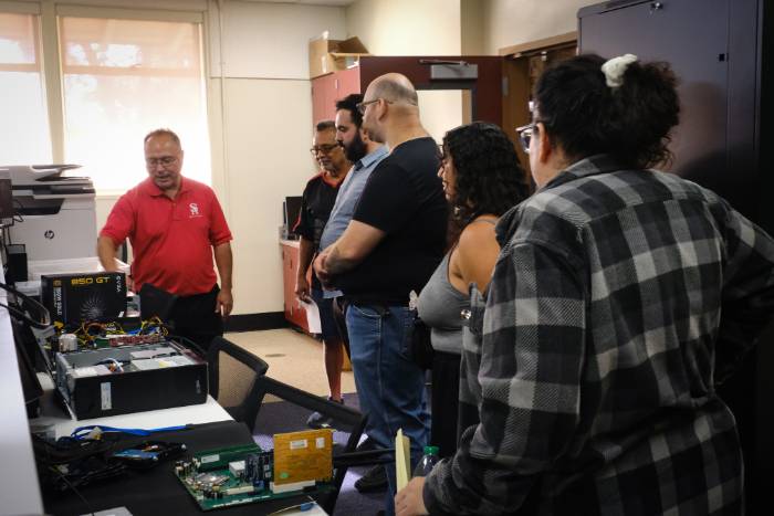 Teacher instructing students in free IT Computer Repair class at Centennial Education Center near Fountain Valley, Orange, and Irvine.