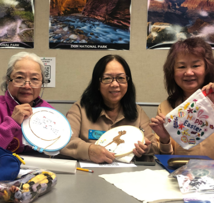 Students finishing artwork for free embroidery class at Santa Ana College, near Anaheim, Irvine, and Westminster.