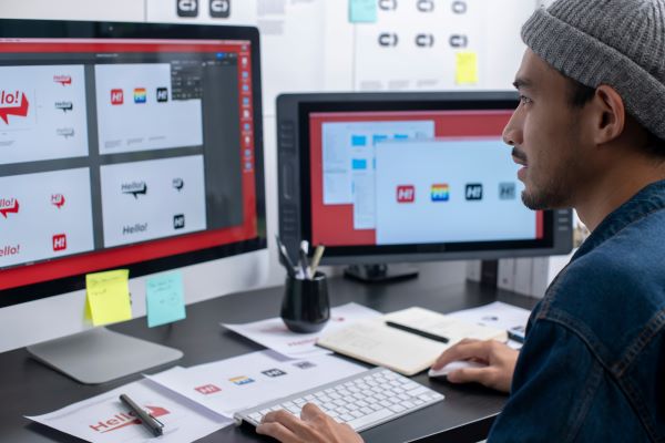 Digital media specialist in office after getting certified with continuing education, near Anaheim, Orange, and Garden Grove