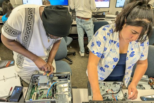 Student repairing computers in IT Certificate program at Santa Ana College, near Anaheim, Fountain Valley, and Irvine.