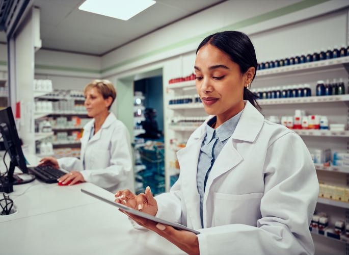 oman working as pharmacy tech  using math skills and prescription labels learned at Santa Ana College